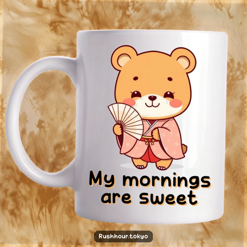Funny playful bear character in a formal kimono smiles while holding a delicate fan, featured on a charming coffee mug.