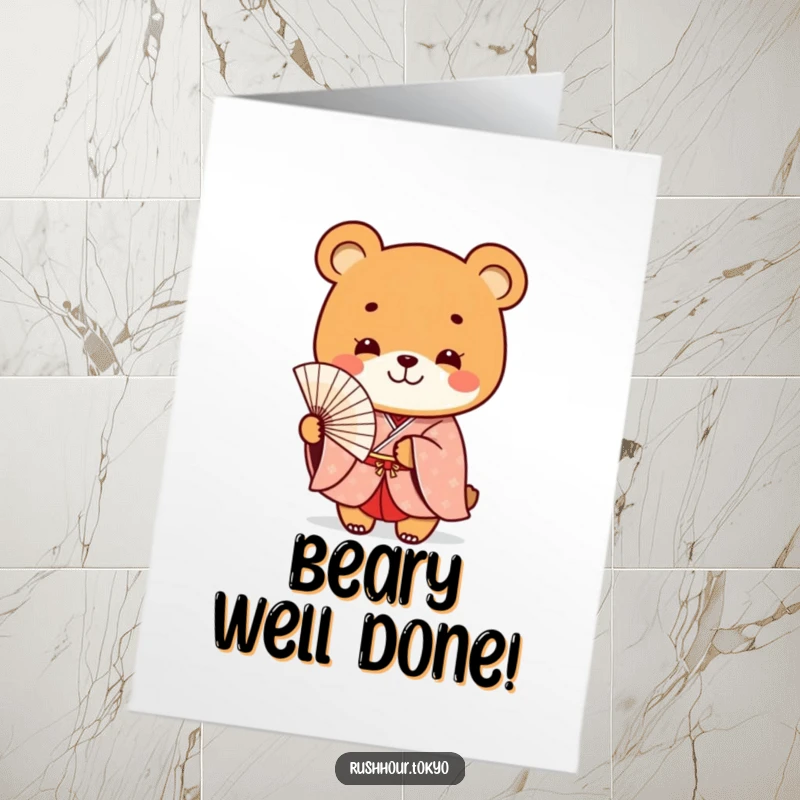 Funny Free Printable congratulations card featuring a playful bear in a formal kimono smiling and holding a delicate fan.