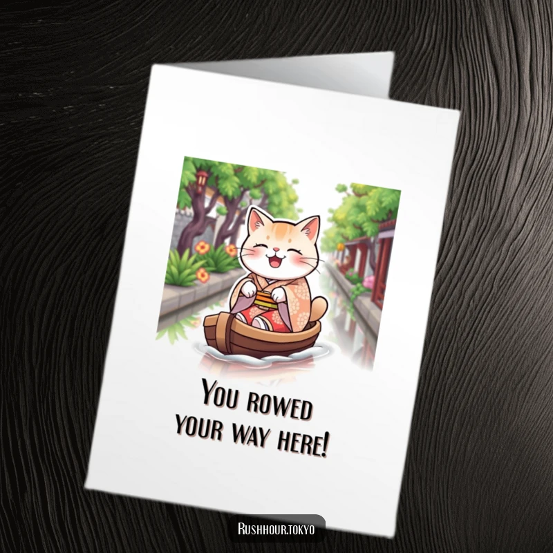 Funny Free Printable congratulations card with a plump cat in a kimono excitedly rowing a boat on water.